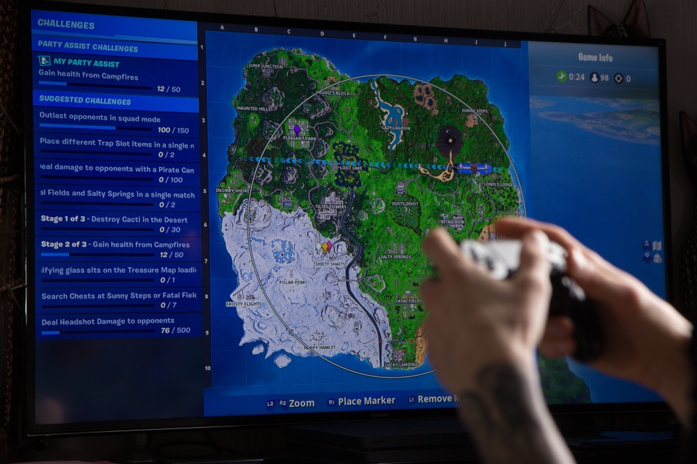 A computer screen shows a Fortnite map