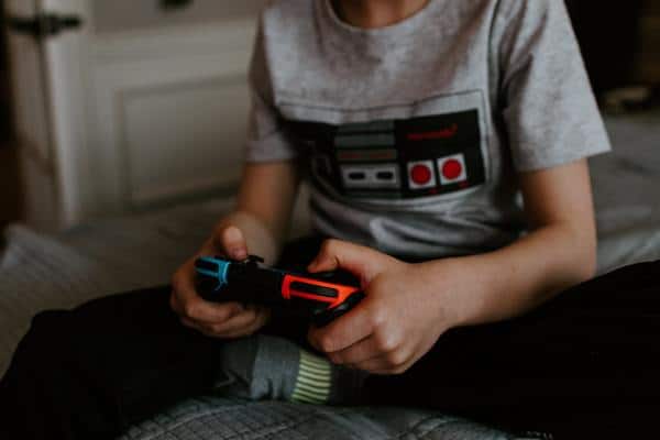 Teenager using a game controller.