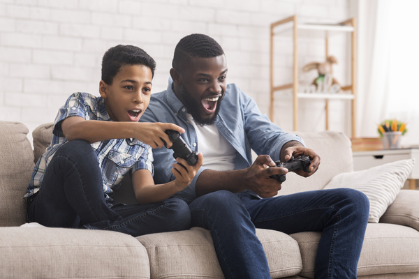 Parent and child playing a video game